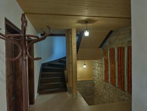 a hallway with a staircase in a house at Къща Владислав in Radevtsi +9 photos