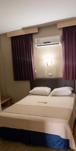 Postel nebo postele na pokoji v ubytování Hotel Riviera