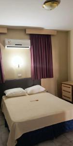 Postel nebo postele na pokoji v ubytování Hotel Riviera