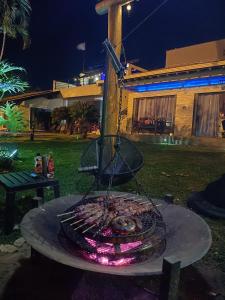 a grill with some food on top of it at Rancho do Mirante in Araçatuba