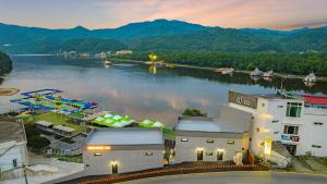 a view of a river with boats in the water at Gapyeong Sungshine Pension in Gapyeong
