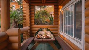 a table on the porch of a cabin with a tray of food at Seogwipo Neulbada Pet Pension in Seogwipo