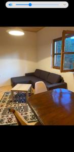 a living room with a couch and a table at VIG 2 in Njegovuđa