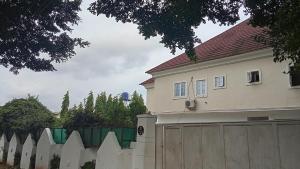 a house with a fence in front of a house at Hotel House 1 in Abuja