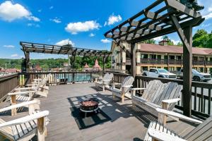 a group of chairs on a deck with a fire pit at Quality Inn in Helen