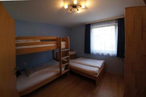 Posteľ alebo postele v izbe v ubytovaní Apartment Lasch in Adler Resort