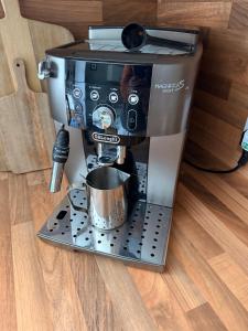 a coffee machine sitting on a counter with a cup at The townhouse in Stornoway