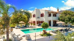 an image of a villa with a swimming pool at Cretan Dream Villa in Georgioupolis