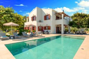 an image of a villa with a swimming pool at Cretan Dream Villa in Georgioupolis