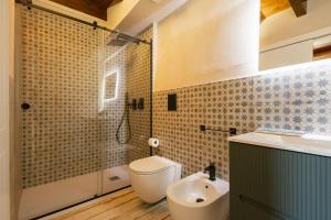 a bathroom with a toilet and a shower and a sink at Mulino 1220 in Scopello +18 photos
