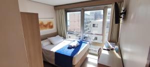 Llit o llits en una habitació de Hotel Dan Inn Express Porto Alegre - Próximo ao Complexo Santa Casa e Araújo Viana