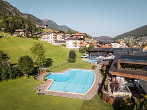 an aerial view of a resort with a swimming pool at Garni Toni in Ortisei
