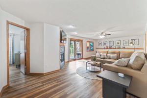 a living room with a couch and a table at Des Moines 4BR Family Getaway in Des Moines