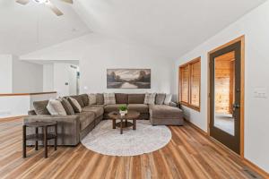 a living room with a couch and a table at Des Moines 4BR Family Getaway in Des Moines