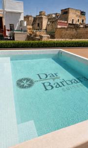 a swimming pool with the words do my banking on it at Dar Barbara Suites in Birgu