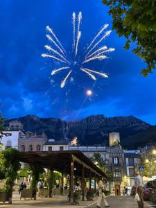 a firework display in a city at night at Casa de la abuelita in Cazorla