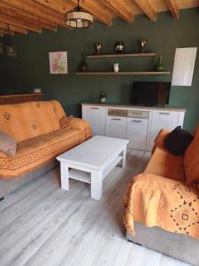 a living room with a couch and a coffee table at El Llugar de las Drusas in Fontanina