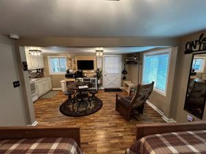 a living room with a kitchen and a dining room at Old No. 8 Cabin in Alpine