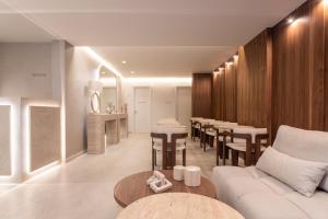 a living room with a couch and a table at Anthem Suites & Spa in Athens