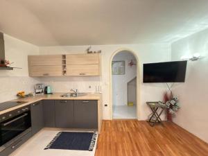 a kitchen with a sink and a counter top at Apartman Luna in Šibenik +14 photos