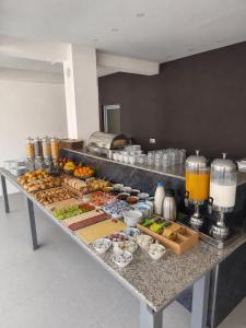 a buffet with many different types of food on a table at Maxhuri Apartments in Ulcinj