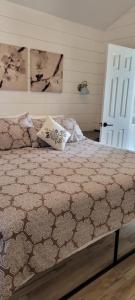 a bed with two pillows on it in a bedroom at SANDY BEACH Paradise On The Beach in Lincoln Junction