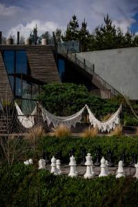 a large white hammock in front of a building at Taka Matanzas in Matanzas