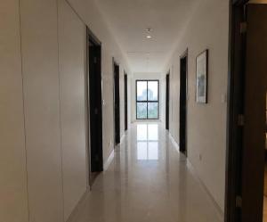 an empty hallway with a window in a building at Lodha Crown Premium 2BHK Thane in Thane