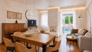 a living room with a table and a couch at Villa Kallergi Nefeli in Loutra