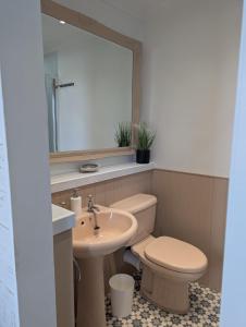 a bathroom with a toilet and a sink at Treheveras Guest House in Newquay +46 photos