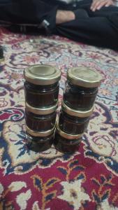 two jars of jam sitting on top of a rug at Forest Glen Cottage in Wāmpor