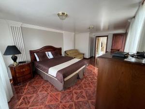 Tempat tidur dalam kamar di Hotel Rocío