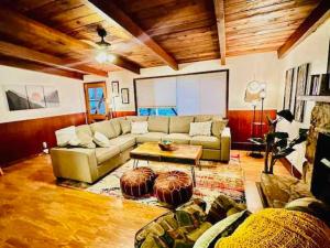 a living room with a couch and a table at Orange Door Electric Fireplace bbq in Oakhurst