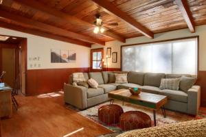 a living room with a couch and a table at Orange Door Electric Fireplace bbq in Oakhurst