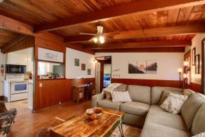 a living room with a couch and a table at Orange Door Electric Fireplace bbq in Oakhurst +24 photos