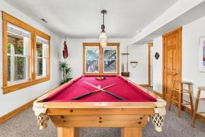 a pool table in a living room with at 8198 - Still Waters in Waves