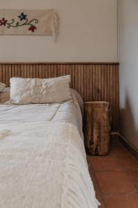 Llit o llits en una habitació de Hotel de Diseño con Desayuno FG Tafí