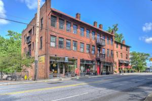 a large red brick building on a city street at Historic King James Unit 1 in Asheville