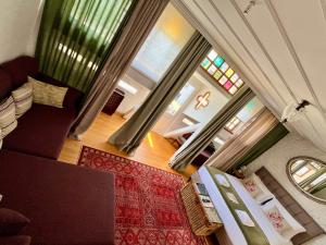 an overhead view of a living room with a couch and windows at Levant Company Pension de Luxe in Istanbul