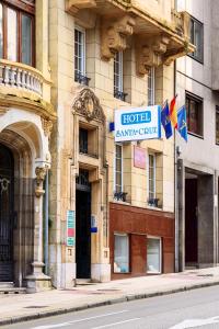a building with a hotel saturday club sign on it at Santacruz in Oviedo