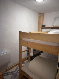 a bedroom with two bunk beds in a room at B&B cot in La Ferrière