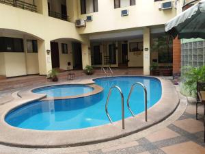 a swimming pool in the middle of a building at 722 Metropolis Tower Unit 212 in Bacolod