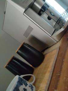 a toaster oven sitting on top of a counter at Villa Euris Guesthouse in Brits