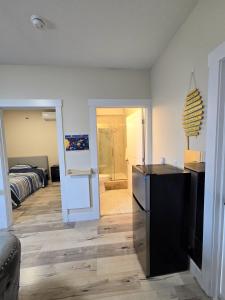 a living room with a kitchen and a bedroom at 1 bedroom apartment in Halifax