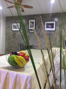 a bowl of fruit on top of a table at Maesot Siri in Mae Sot