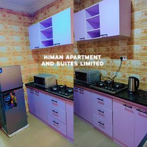 a kitchen with purple cabinets and appliances in a room at Himan Apartment And Suites in Asipa