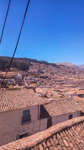 a view of a city from the roof of a building at Loki Cusco in Cusco
