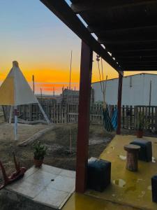 a view of the sunset from the patio of a house at Holgger House in Talara