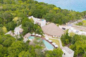 an aerial view of a house with a swimming pool at Nalhá Hotel Boutique y Villas Bacalar in Bacalar