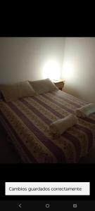 a bedroom with a bed with at Memento Vivere Boutique rooms in Neuquén +5 photos
